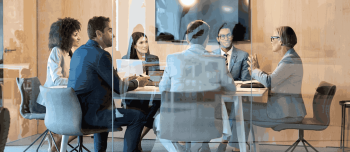 Group of people at a conference table Group of people at a conference table