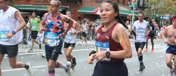 A close up photo of runners mid marathon