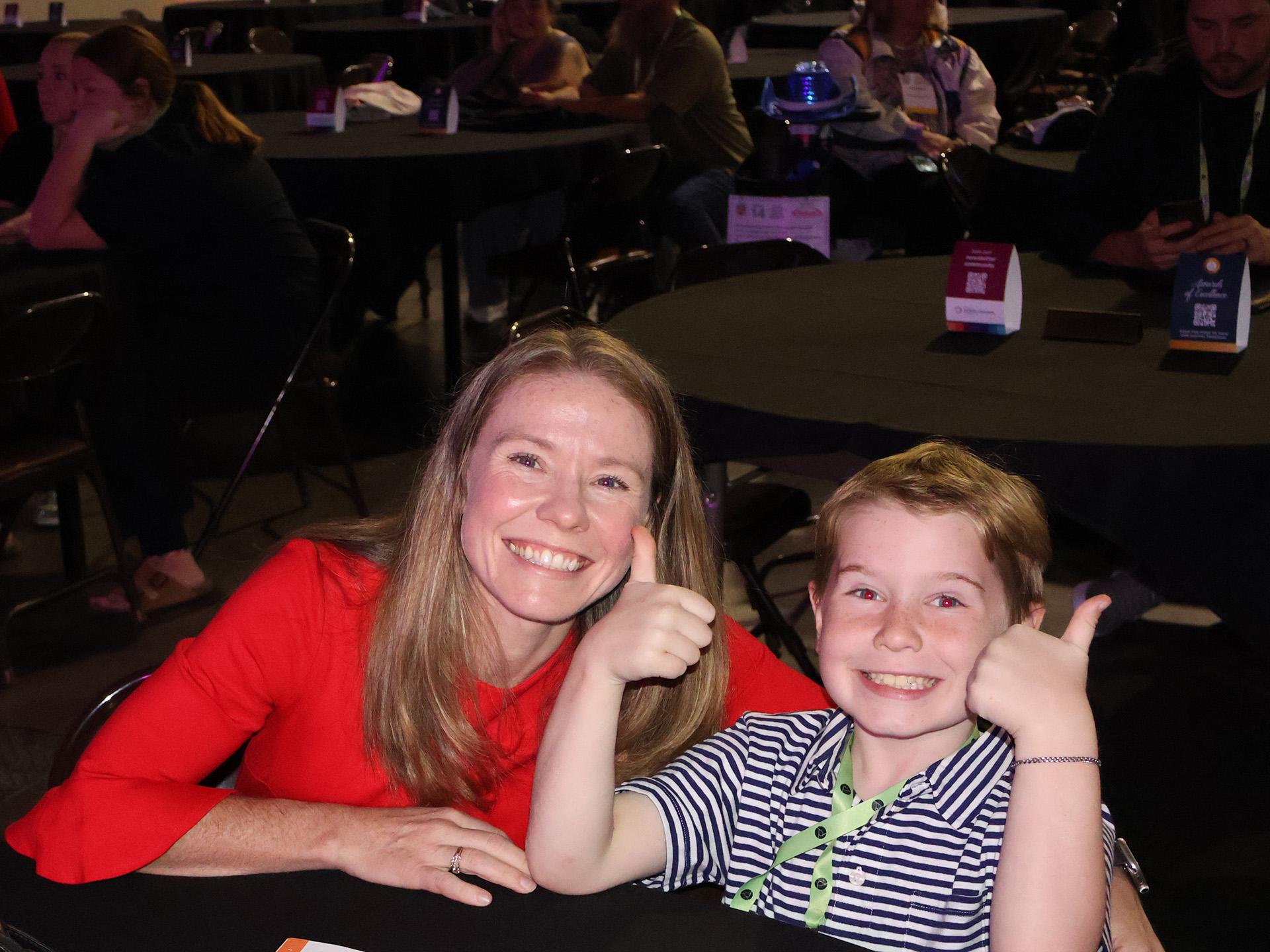 A mother and son smiling for the camera at BDC 2024