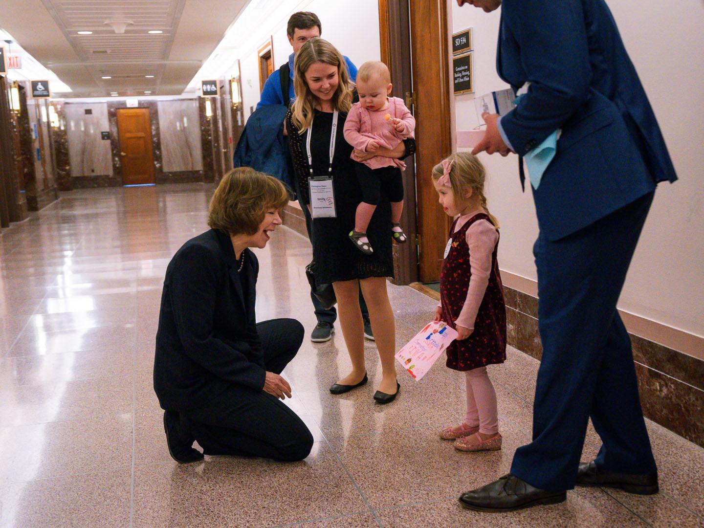 A family visiting their representative at Washington Days